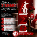Load image into Gallery viewer, A promotional graphic for a Delta Sigma Theta 32-inch tall red acrylic standing display. The image shows a red 3D Sigma symbol with a white delta symbol on top, set in a decorated room with a red sofa, pillows, and a side table.
