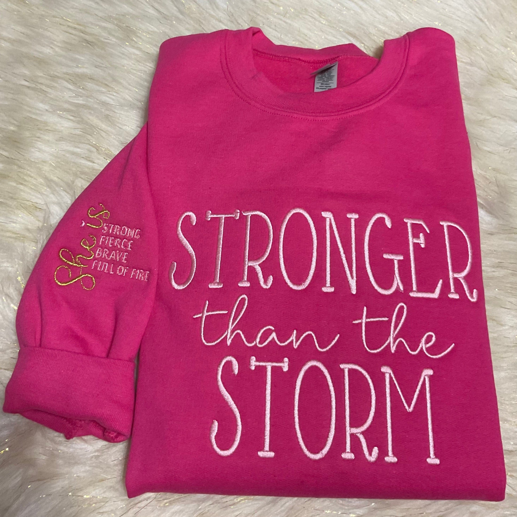 STRONGER THAN THE STORM EMBROIDERED SWEATSHIRT