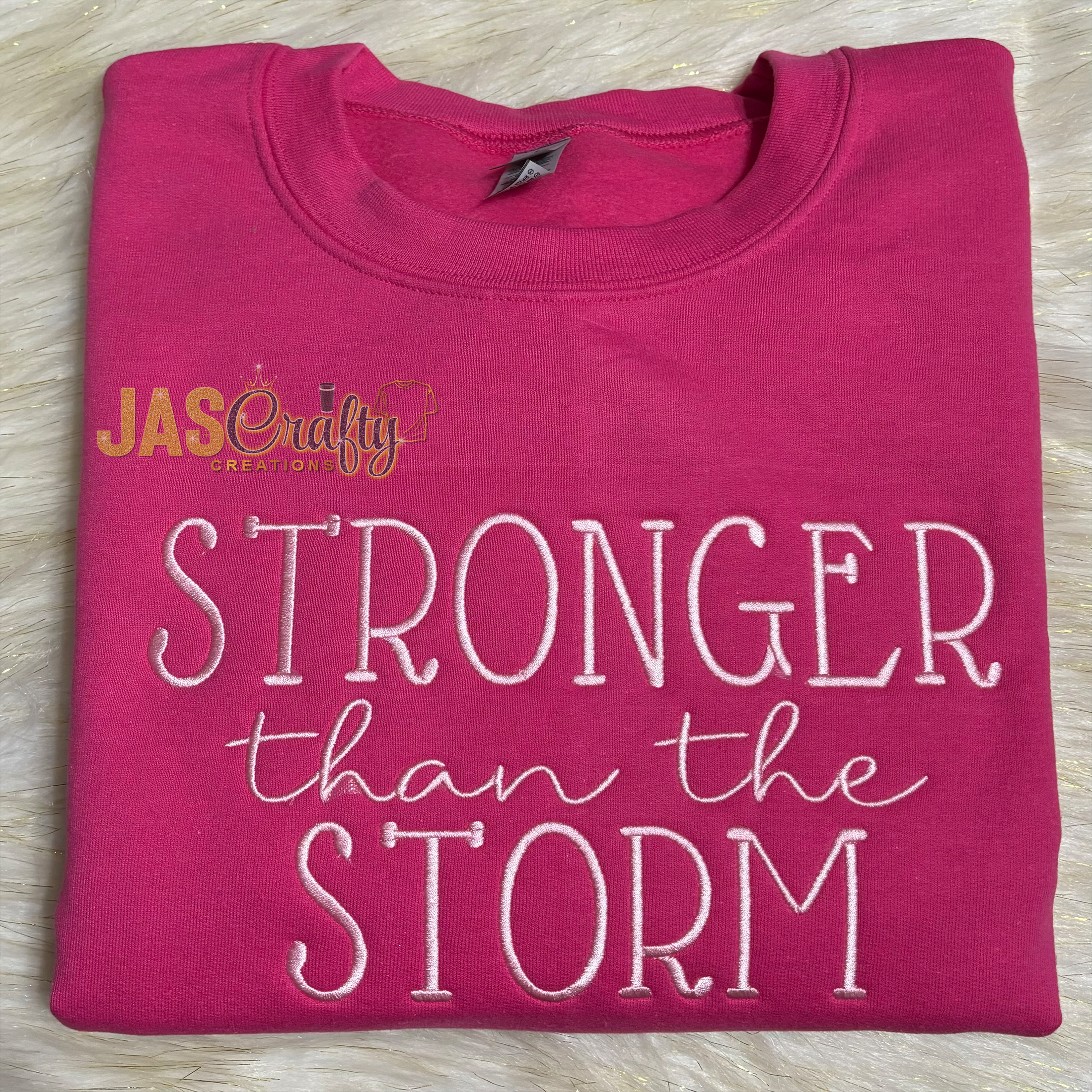 STRONGER THAN THE STORM EMBROIDERED SWEATSHIRT